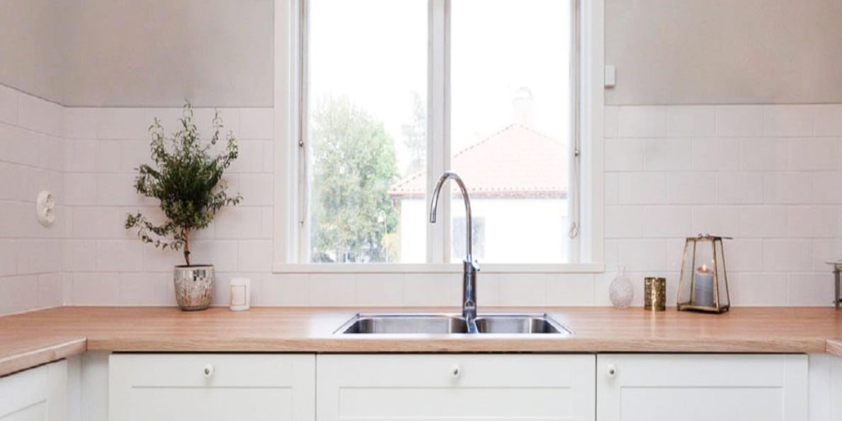 How to Vent a Kitchen Sink Under a Window